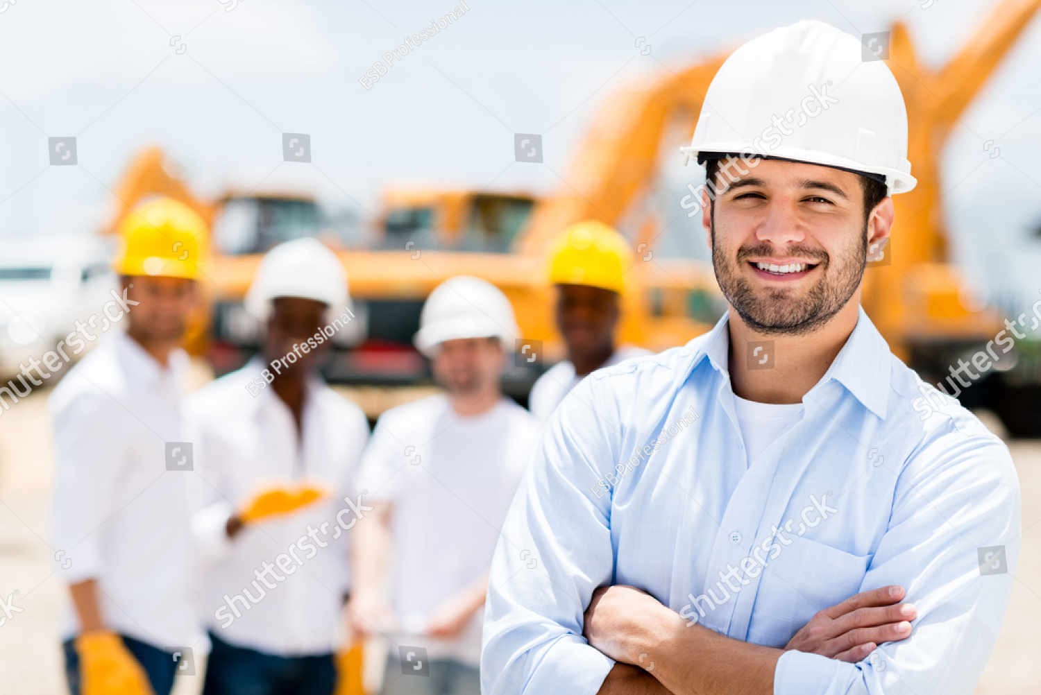 stock-photo-successful-male-architect-at-a-building-site-with-arms-crossed-150120215